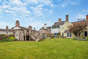 an exterior view of a large house with a yard at 3 Bed in Ruthin oc-a29313 in Ruthin