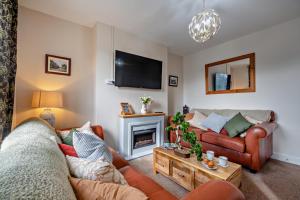 a living room with a couch and a fireplace at 3 Bed in Llanbedr oc-t28932 in Llanbedr