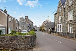 an empty street in a town with stone houses at 3 Bed in Llanbedr oc-t28932 in Llanbedr