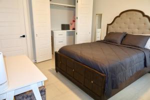 a bedroom with a large bed and white cabinets at Rabbit Run Home in Alton