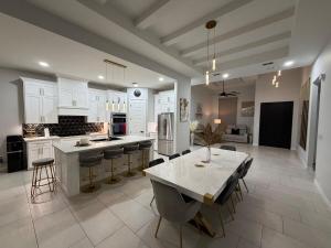 a large kitchen with a table and chairs in it at Rabbit Run Home in Alton