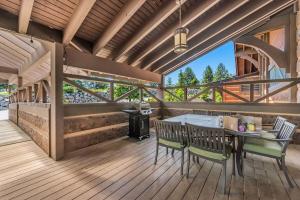 a patio with a table and chairs on a deck at Stoneridge Resort in Blanchard