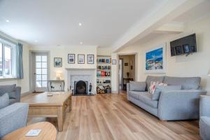 a living room with two couches and a fireplace at 4 Bed in Aldeburgh oc-16faw in Aldeburgh