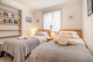 a bedroom with two beds and a window at 4 Bed in Aldeburgh oc-16faw in Aldeburgh