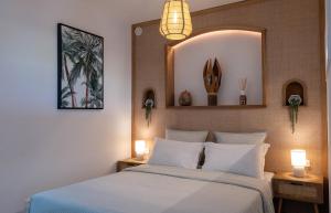 a bedroom with a large bed with two night stands at Palm Beach Studio - New Beach Residence in Saint Martin +14 photos