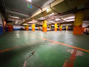 an empty parking garage with cars parked in it at Hotel Formosa in Caotun