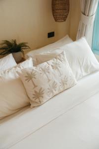 two beds with white sheets and a pillow on them at Indie Beach Koh Chang in Ko Chang +132 photos