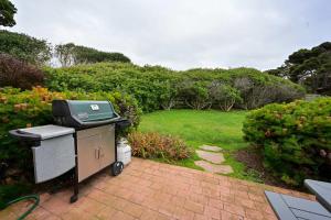 a bbq grill sitting in a garden at Dream Scape in Fort Bragg