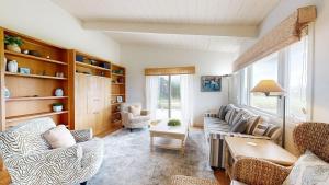 a living room with a couch and chairs and a table at Dream Scape in Fort Bragg