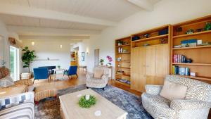 a living room with a couch and a table at Dream Scape in Fort Bragg