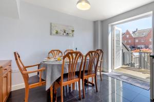 a dining room with a table and chairs and a window at 3 Bed in Felixstowe oc-p29748 in Felixstowe +20 photos