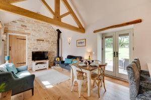 a living room with a table and chairs at 2 Bed in Danby oc-wa315 in Castleton