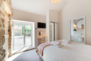 a bedroom with a bed and a large window at 2 Bed in Danby oc-wa315 in Castleton