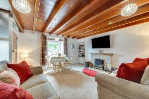 a living room with a couch and a fireplace at 2 Bed in Thwaite oc-ds946 in Thwaite