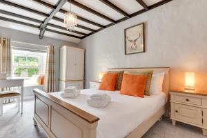 a bedroom with a bed with two towels on it at 2 Bed in Thwaite oc-ds946 in Thwaite