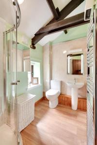 a bathroom with a toilet and a sink at 2 Bed in Arkengarthdale oc-ds951 in Richmond +23 photos