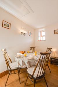 a dining room with a table and two chairs at 2 Bed in Chatton oc-nb620 in Chatton