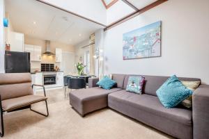 a living room with a couch and a kitchen at 2 Bed in Padstow oc-p00398 in Saint Merryn