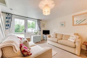 a living room with a couch and a tv at 2 Bed in Penzance oc-pc467 in Gulval
