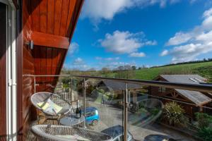 a balcony with a view of the countryside at 4 Bed in Wadebridge oc-p00066 in Little Petherick