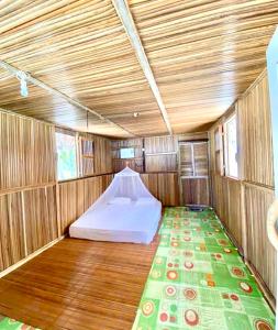 a small room with a bed in the back of a train at Saubaryam Home stay in Fam