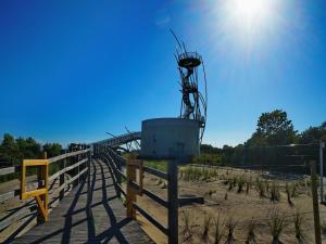 a view of a fence with a lookout tower on a beach at Apartment with Pool and Sea View in Middelkerke