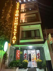 a building with a sign on the side of it at Cozy 86 Homestay in Can Tho