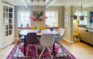 a dining room with a table and chairs at Amazing Home In Ulfborg With Kitchen in Ulfborg