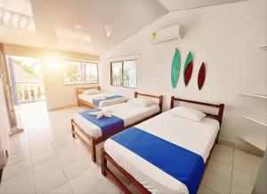 a bedroom with two beds in a room at Tintipan Hotel in Tintipan Island +50 photos
