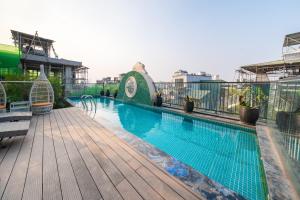 a swimming pool on the roof of a building at Nature Hotel and Spa Ha Noi in Hanoi