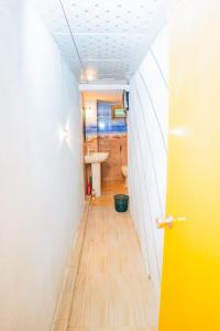 a hallway with a bathroom with a sink and a toilet at Ceylon Retreat Villa in Kamburugamuwa +2 photos