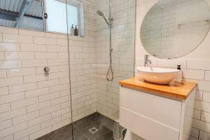 a bathroom with a sink and a shower at Cindy's View in Bright +25 photos