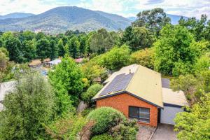 an aerial view of a house with solar panels on the roof at Cindy's View in Bright