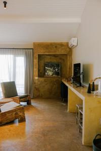 a living room with a couch and a fireplace at Vila Figo in Trancoso