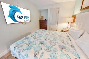 a bedroom with a bed and a sign on the wall at Romantic Honey Moon Suite, Direct Oceanfront,Pools in Myrtle Beach
