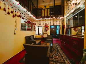 a living room with couches and christmas decorations at Ñusta Wasi in Cusco