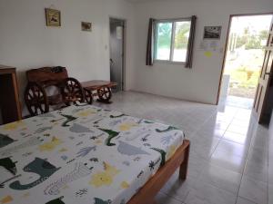 a bedroom with a bed in a room at Kathleens Vacation Place in Moalboal +96 photos
