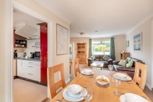 a kitchen and living room with a table and chairs at 2 Bed in Wooler oc-l29429 in Wooler