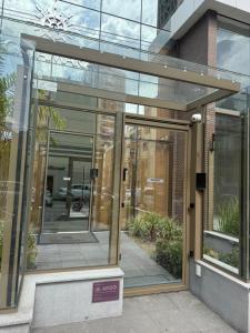 an entrance to a building with glass doors at Tranquilidade e conforto proximo ao mar in Vila Velha