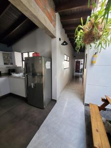 a kitchen with a stainless steel refrigerator in a room at Envigado tradicion y modernidad in Envigado