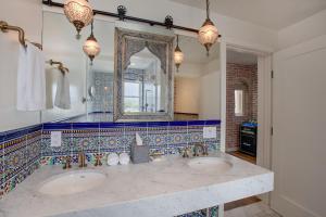 a bathroom with two sinks and a mirror at Venice V Hotel in Los Angeles +68 photos