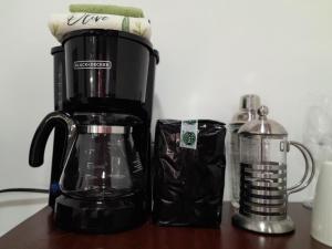 a coffee maker sitting on top of a table at Perfect Getaway #1 in La Libertad