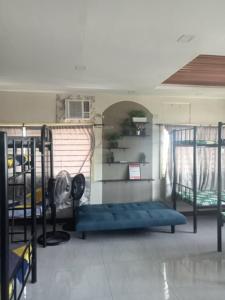 a dorm room with two bunk beds and a window at JY7 Rooms 414 in Cebu City