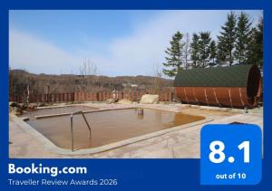 a large pool of water in a yard at Hotel Shiretoko in Shari +24 photos