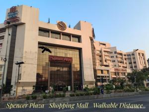 a large building with a clock on top of it at Sarovara Deluxe Rooms in Chennai