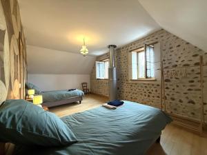 a bedroom with a bed in a room at Lo casalar in Noguères