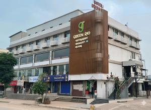 a building with a sign on the side of it at hotel green rio in Ahmedabad