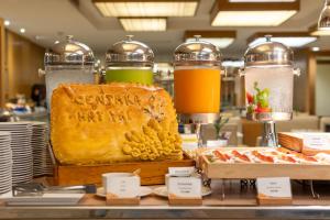 a bakery with a loaf of bread on a counter at Centara Hotel Hat Yai in Hat Yai