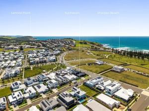 an aerial view of a city with houses and the ocean at Sunhaven in North Creek