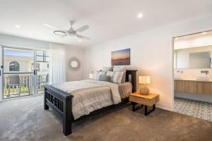 a bedroom with a bed and a large mirror at Sunhaven in North Creek